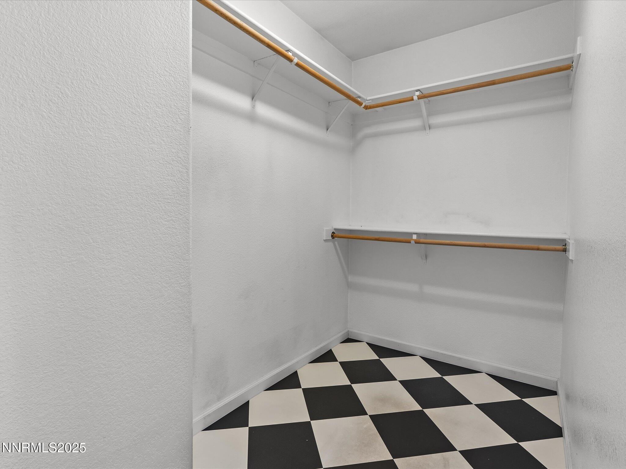 450 Len Circle Reno, NV 89511 - Photo 31 of 44 a room with a black and white checkered floor