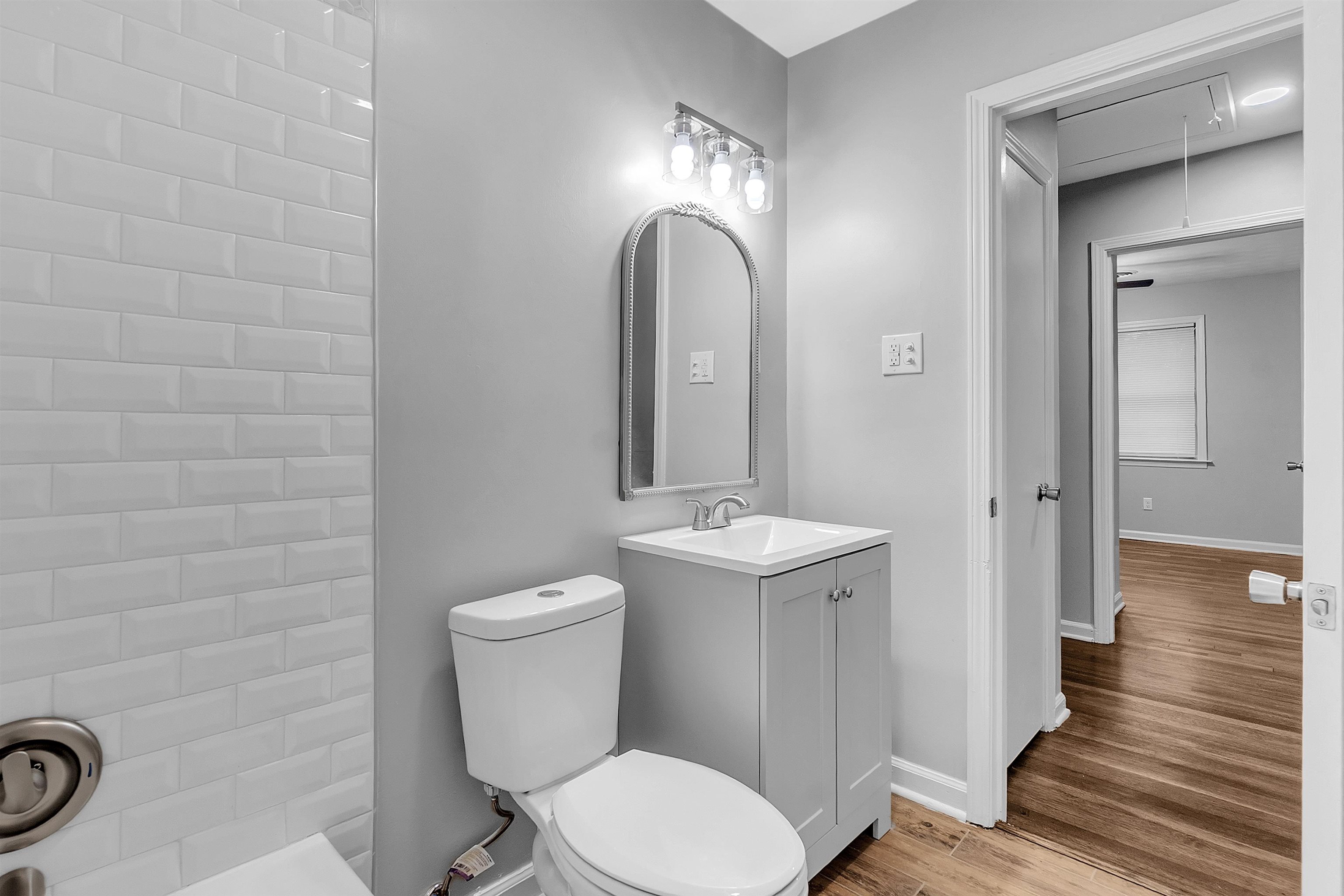 4155 Coventry Drive Memphis, TN 38127 - Photo 4 of 20 a bathroom with a toilet a sink and mirror