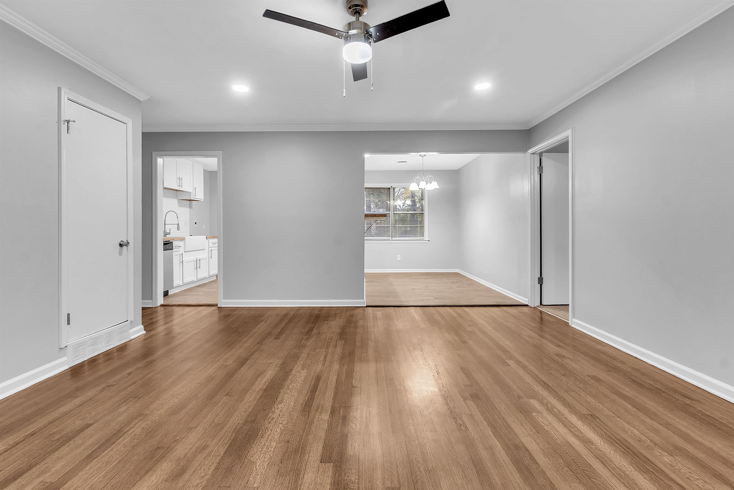 4155 Coventry Drive Memphis, TN 38127 - Photo 7 of 20 an empty room with wooden floor and windows