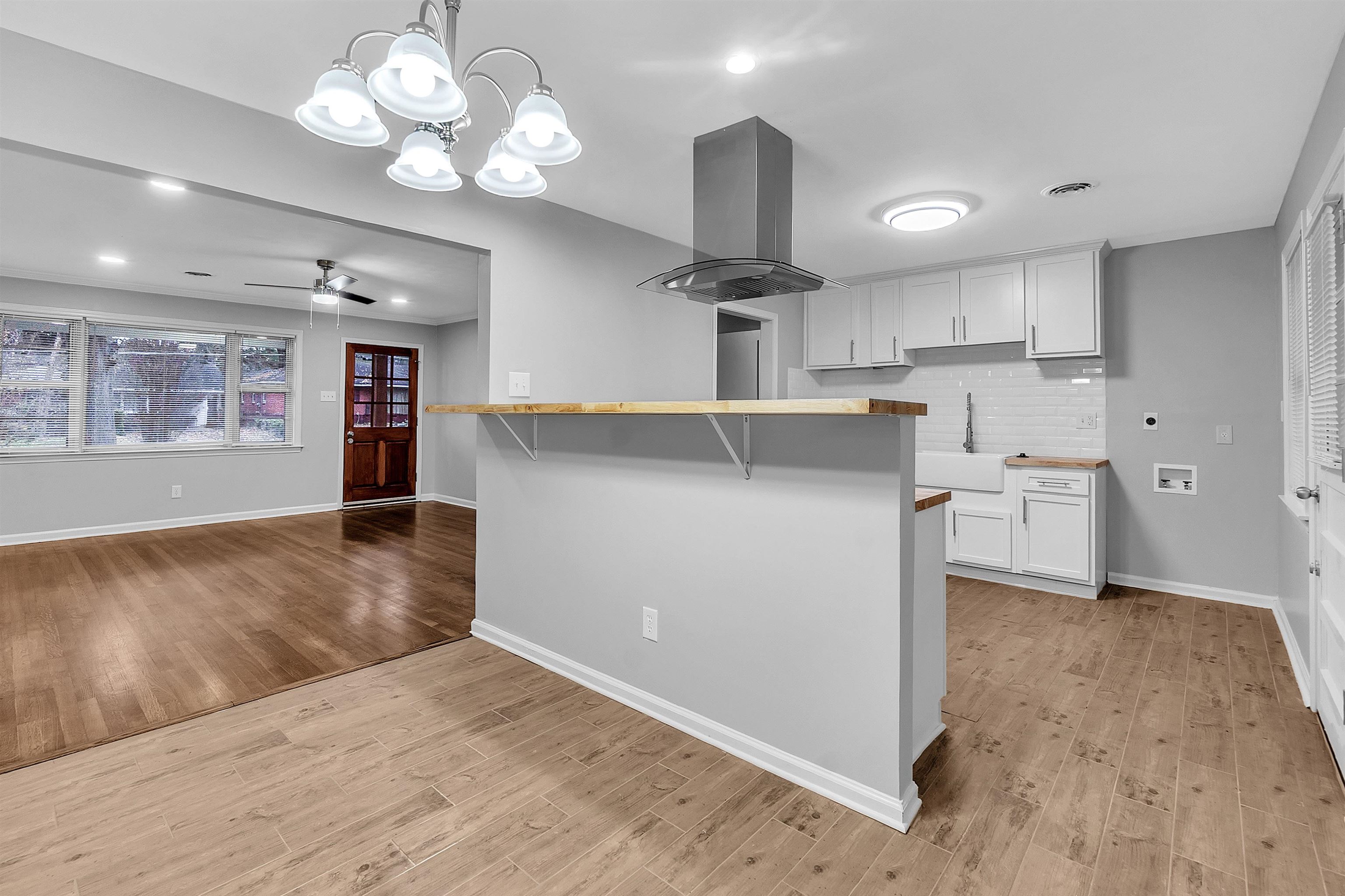 4155 Coventry Drive Memphis, TN 38127 - Photo 8 of 20 a view of a kitchen with a sink and chandelier