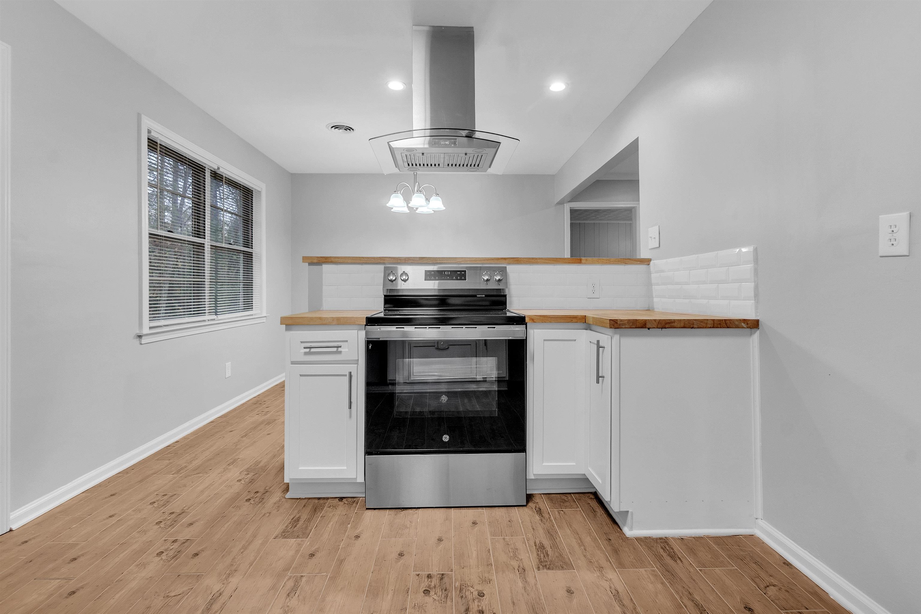 4155 Coventry Drive Memphis, TN 38127 - Photo 10 of 20 an open kitchen with a stove oven and sink