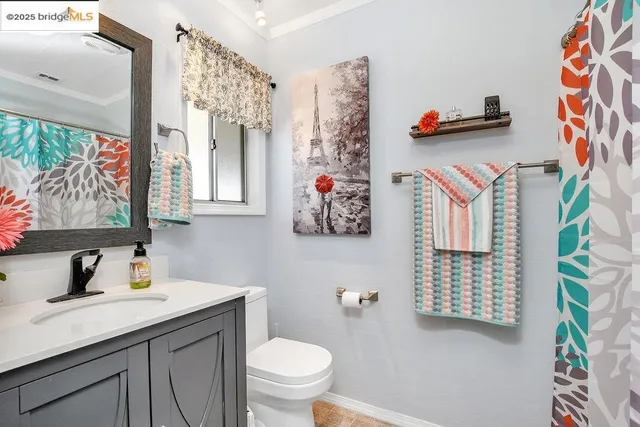 a bedroom with a bed and a mirror