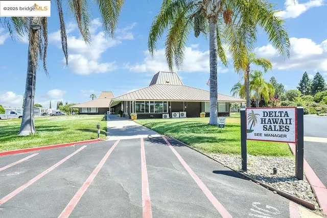 a bathroom with a sink vanity mirror and toilet