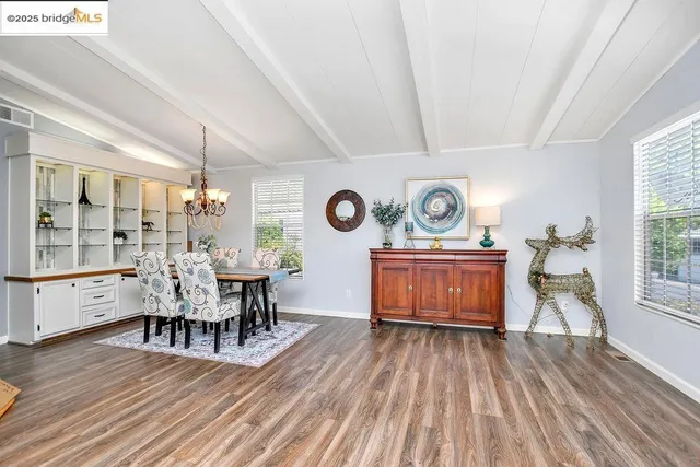 a view of a dining room with furniture window and wooden floor