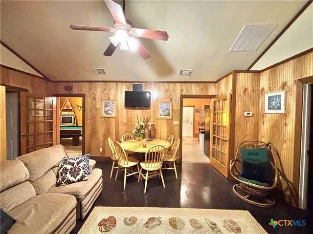 a view of a back yard from a bathroom