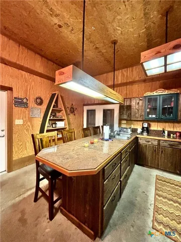 a kitchen with lots of counter top space and appliances