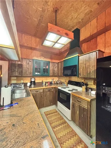 a room with pool table and windows