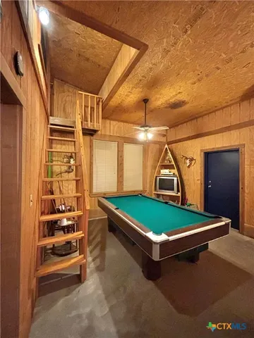 a living room with furniture rug and a flat screen tv