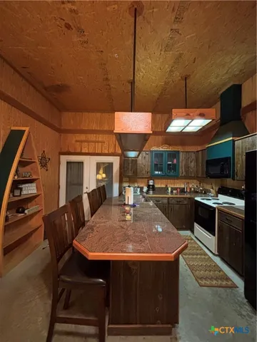 a view of a house with a yard and garage