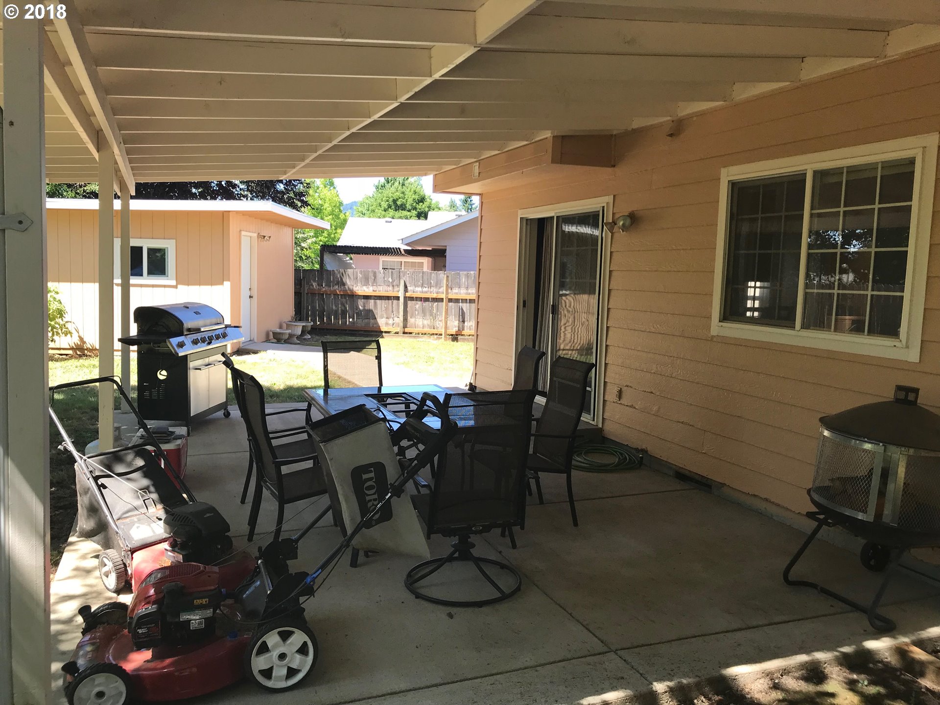 292 72nd Place Springfield, OR 97478 - Photo 11 of 12 a view of a dinning table and chairs in patio