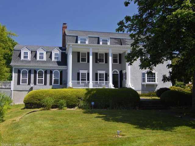 14 Middle Beach Road West Madison, CT 06443 - Photo 1 of 1 a front view of a house with a garden
