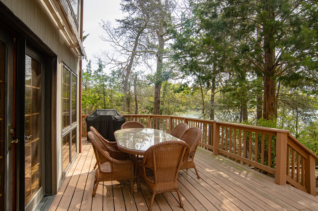 13581 Solitude Trail Machipongo, VA 23405 - Photo 25 of 51 a balcony with wooden floor and furniture