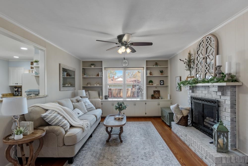 5580 Normandy Road Memphis, TN 38120 - Photo 11 of 25 a living room with furniture and a fireplace