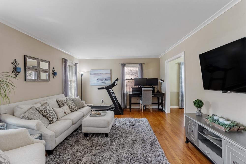 5580 Normandy Road Memphis, TN 38120 - Photo 2 of 25 a living room with furniture and a flat screen tv