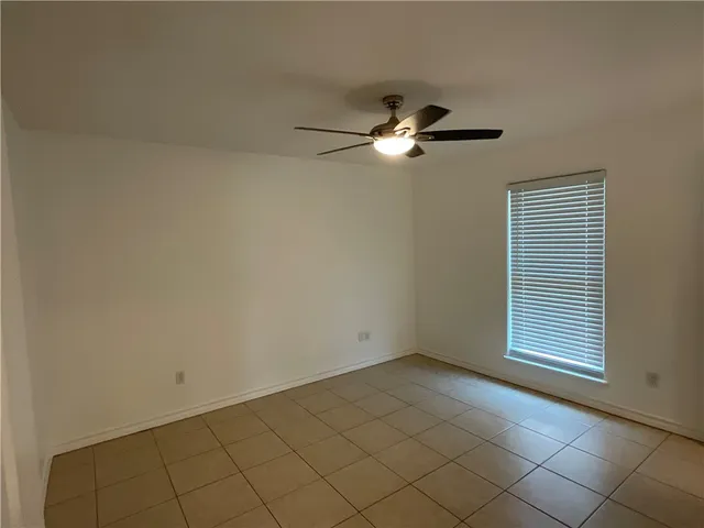 a view of empty room with windows