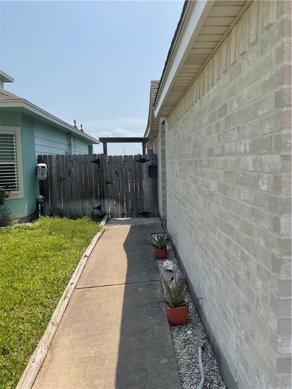 15330 Cruiser Street, Unit A Corpus Christi, TX 78418 - Photo 2 of 20 a view of a backyard