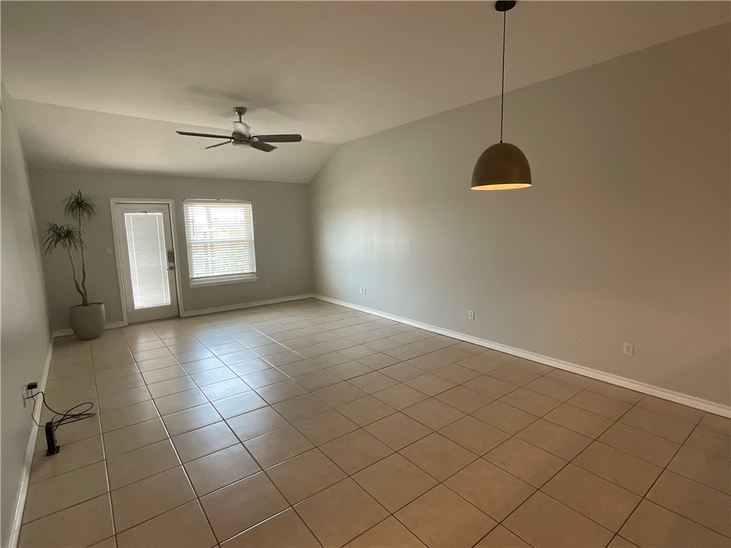 15330 Cruiser Street, Unit A Corpus Christi, TX 78418 - Photo 8 of 20 a view of an empty room with a window
