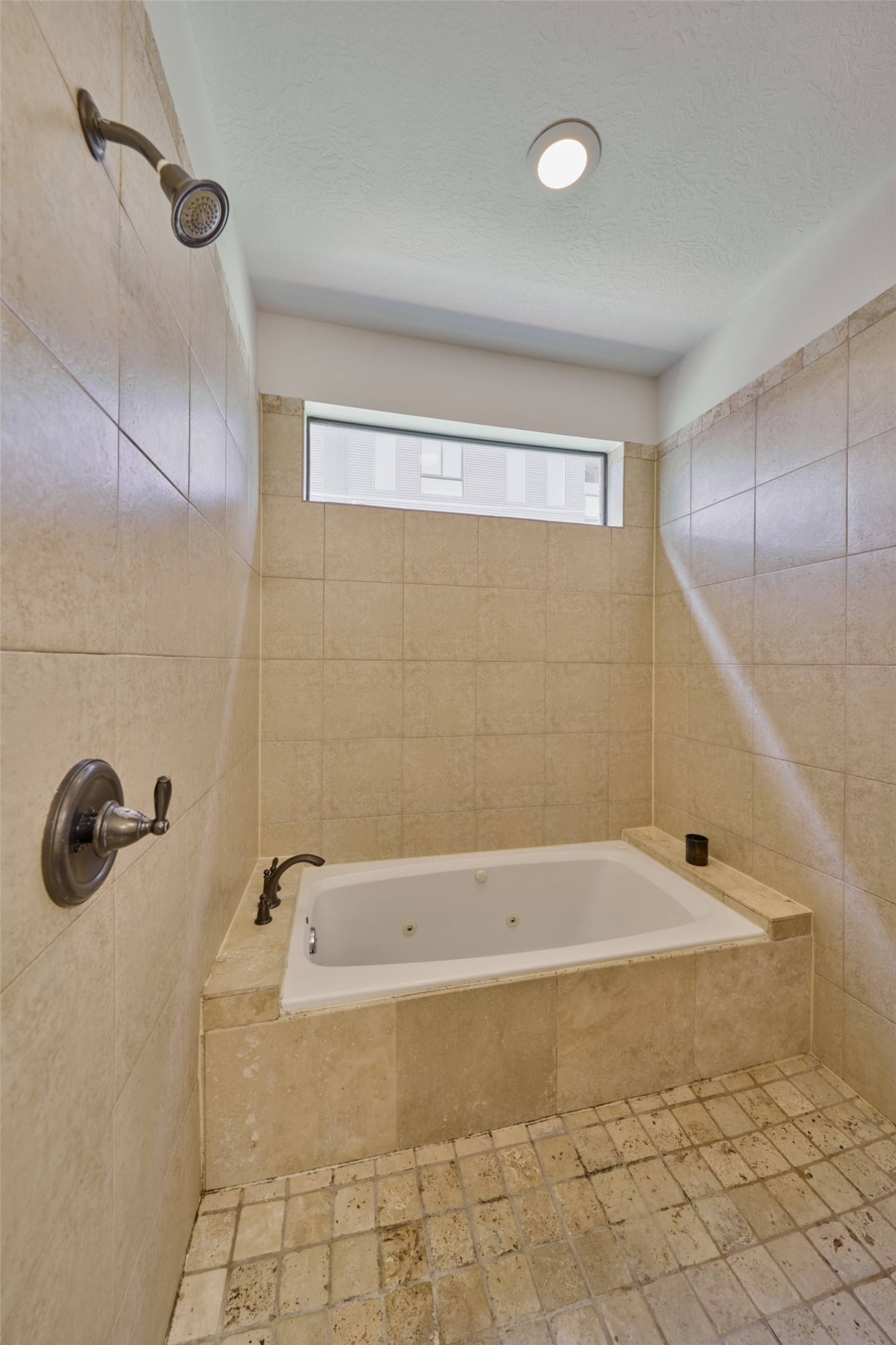 2422 Navigation Boulevard, Unit E Houston, TX 77003 - Photo 23 of 29 a bathroom with a bathtub and shower