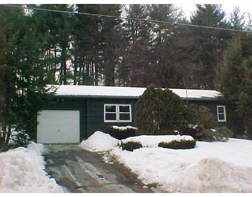 121 Sandy Hill Road Northampton, MA 01062 - Photo 1 of 1 a view of a house with a yard covered in snow