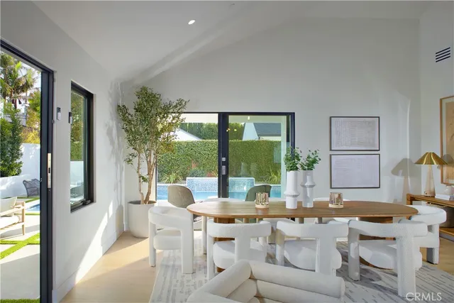 a view of a house with pool and wooden floor
