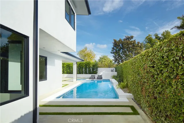 a bathroom with a sink double vanity and a mirror