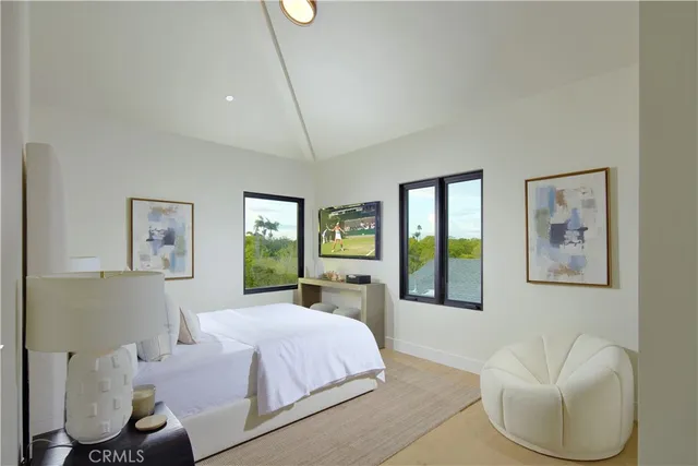 a bedroom with a bed and a night stand