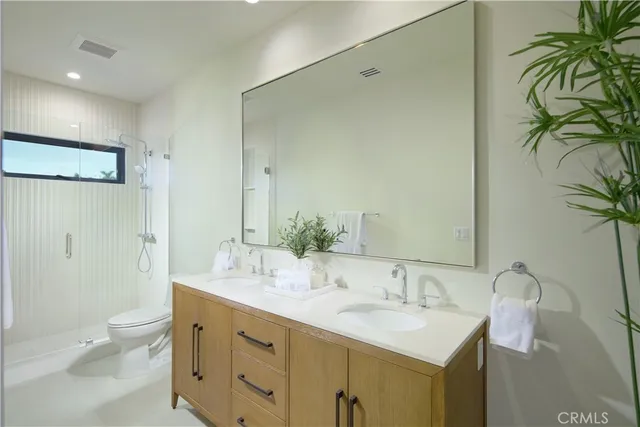 a bathroom with a bathtub sink and mirror