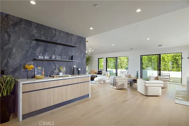 a large kitchen with sink cabinets and stainless steel appliances