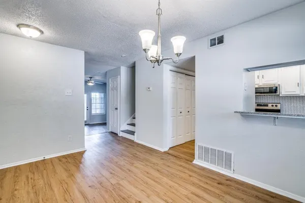 a view of a livingroom with a kitchen