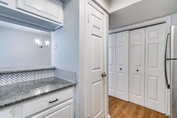 a view of a sink storage and utility room