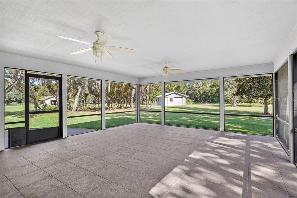171 William Street Edgewater, FL 32141 - Photo 25 of 40 a view of a backyard with wooden fence