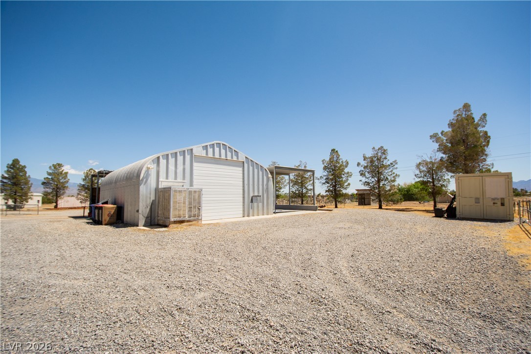 2381 Tough Boy Road Pahrump, NV 89060 - Photo 32 of 44 This spacious property features a durable metal outbuilding, ideal for various needs.