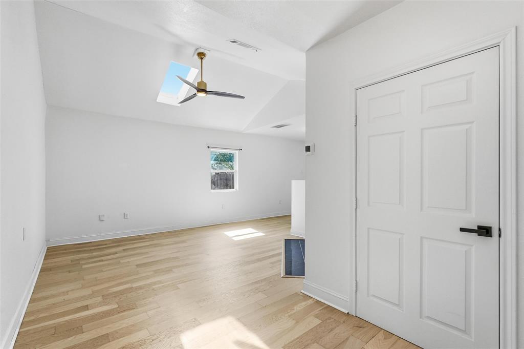 10332 Muskogee Circle Dallas, TX 75217 - Photo 14 of 39 wooden floor in an empty room with a window