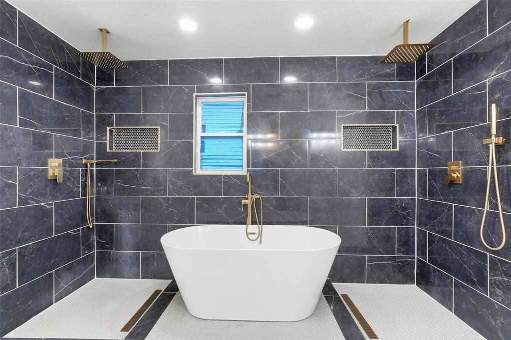 10332 Muskogee Circle Dallas, TX 75217 - Photo 18 of 39 a bathroom with a shower