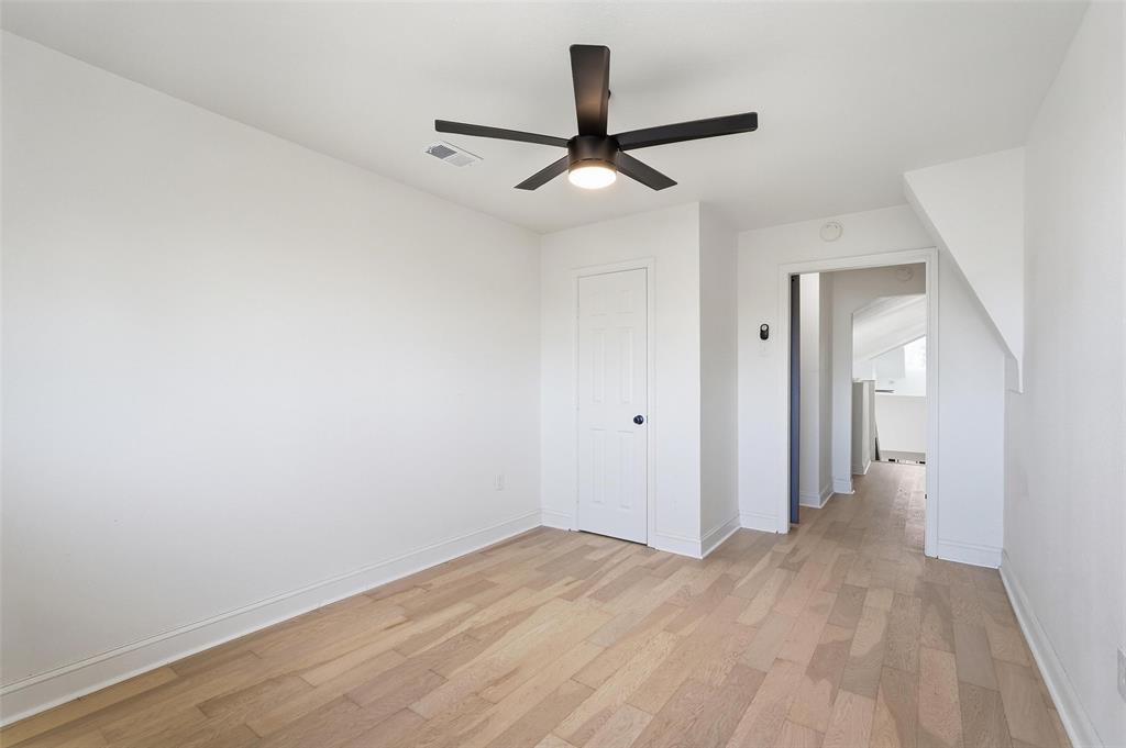 10332 Muskogee Circle Dallas, TX 75217 - Photo 25 of 39 a view of a hallway with wooden floor