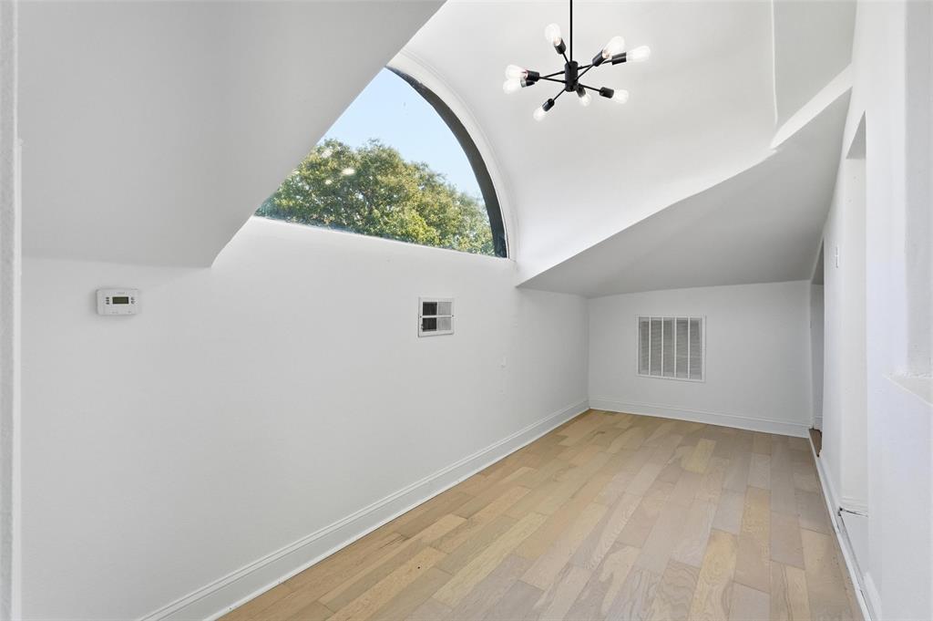 10332 Muskogee Circle Dallas, TX 75217 - Photo 31 of 39 wooden floor in an empty room with a window