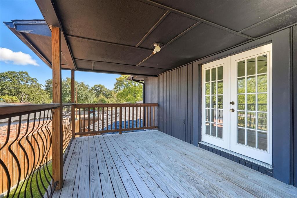 10332 Muskogee Circle Dallas, TX 75217 - Photo 34 of 39 a view of a porch with wooden floor