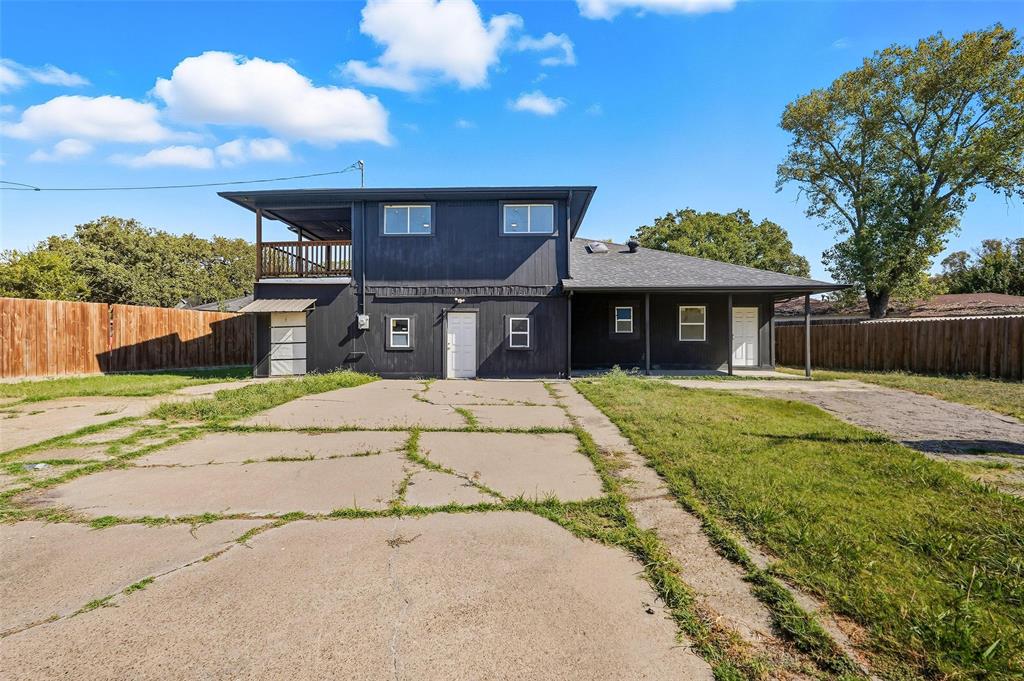 10332 Muskogee Circle Dallas, TX 75217 - Photo 35 of 39 a front view of a house with a yard