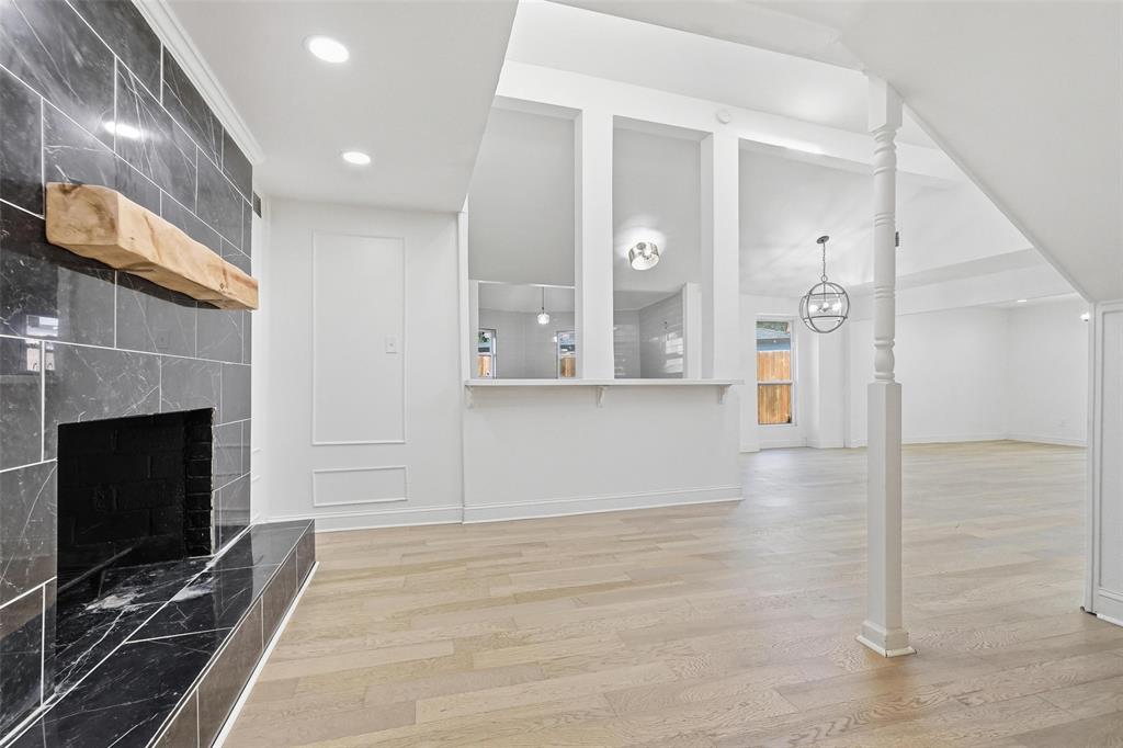 10332 Muskogee Circle Dallas, TX 75217 - Photo 10 of 39 a view of a livingroom with furniture and a fireplace