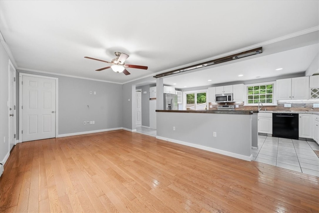 214 Anan Wade Road Glocester, RI 02857 - Photo 11 of 50 The wide opening creates a strong visual connection to the kitchen and keeps the spaces feeling open and inviting.