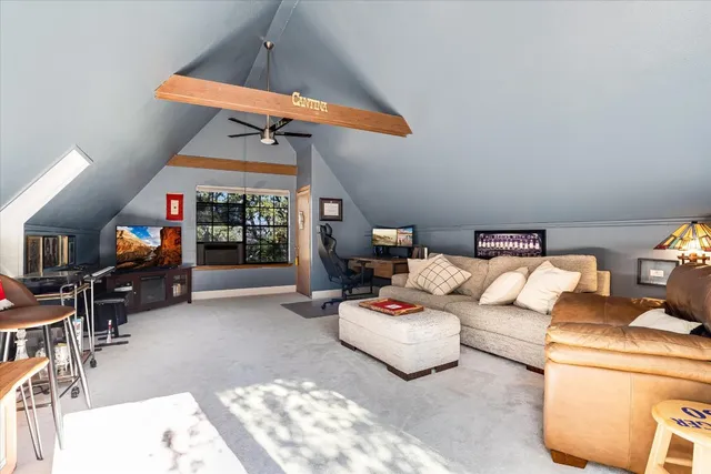 a view of living room with furniture and wooden floor
