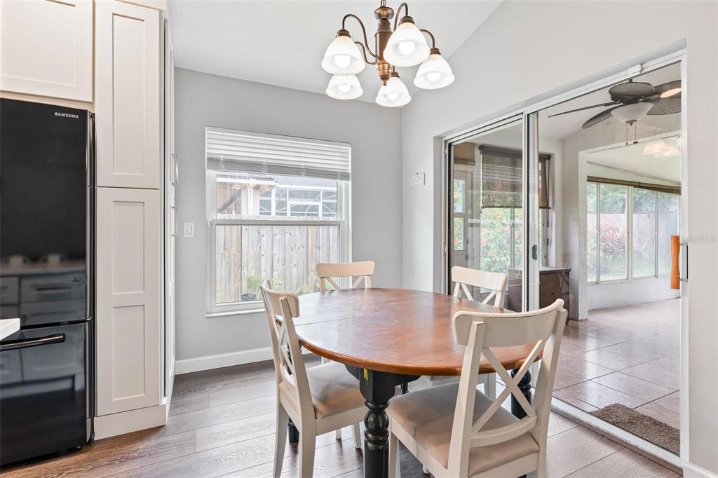 325 Longshadows Court Ocoee, FL 34761 - Photo 13 of 34 a view of a dining room with furniture window and wooden floor