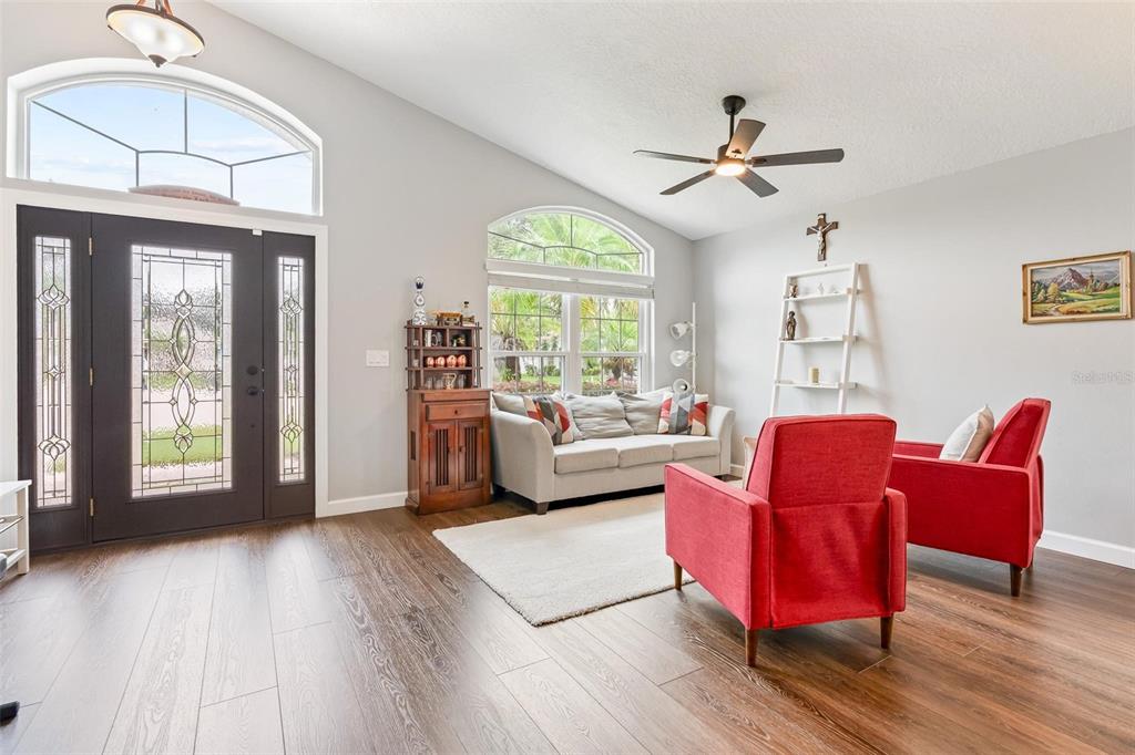 325 Longshadows Court Ocoee, FL 34761 - Photo 3 of 34 a living room with furniture and a large window