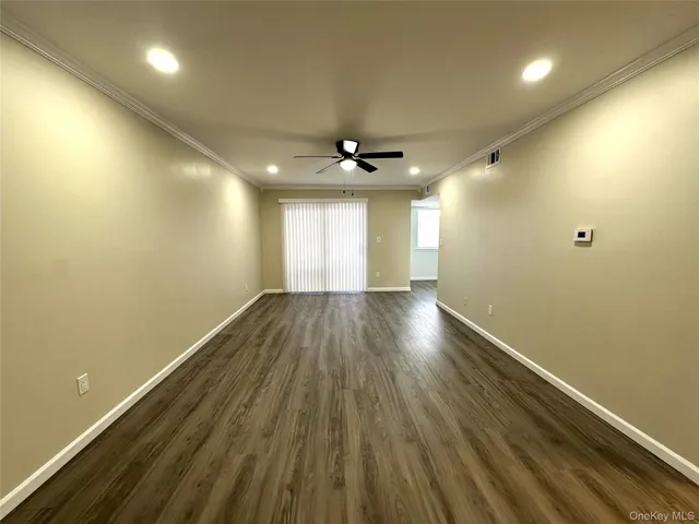 a kitchen with a refrigerator and a sink