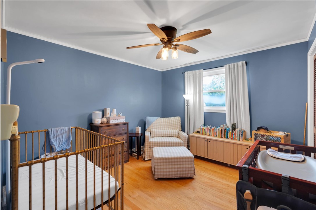 1815 Pearman Dairy Road Anderson, SC 29625 - Photo 20 of 35 Hardwood floors and a ceiling fan create a comfortable atmosphere in this inviting space.