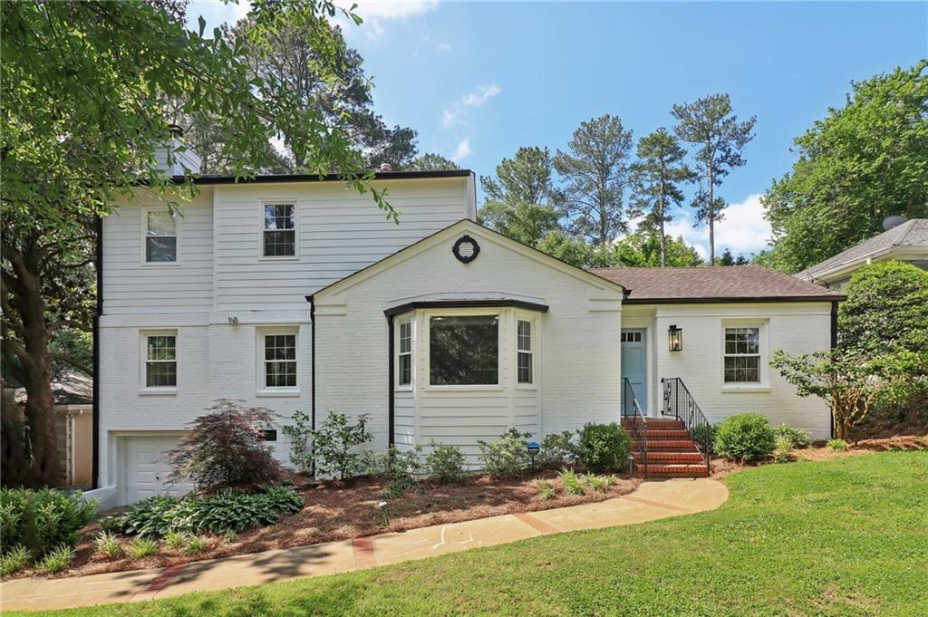 front view of a house with a yard