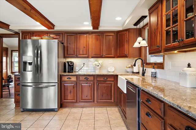 a bedroom with two beds and a window