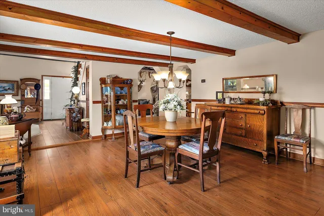 a view of a chairs and table in patio of the house