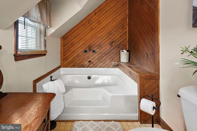 a view of back yard of the house with a street