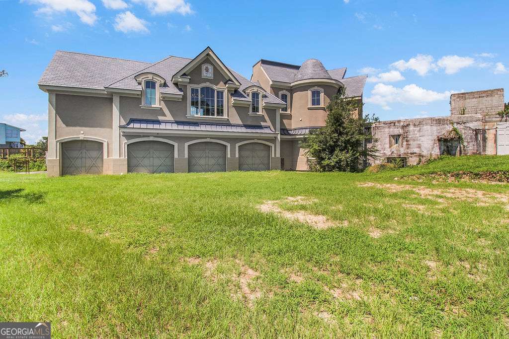 a front view of a house with a yard
